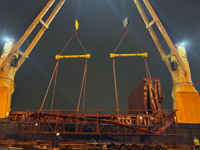 Monitoring discharge of a power plant boiler heavy-lift unit